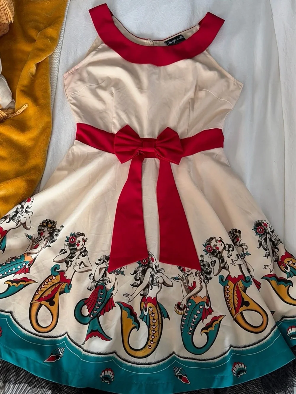 Sourpuss Cream Dress with Red Trim and Teal Mermaid Border